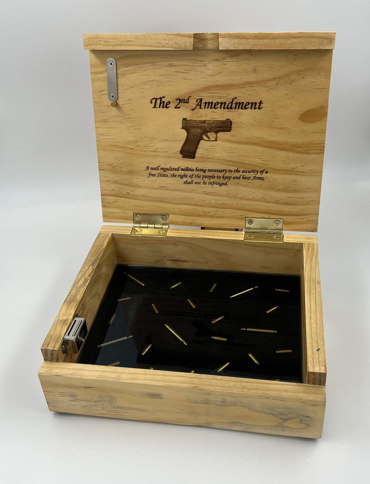 Custom pine firearm case with epoxy bottom containing submerged 5.56 casings and personalized laser engraving